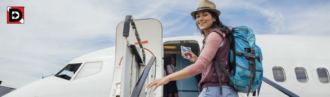 Young woman boarding an airplane